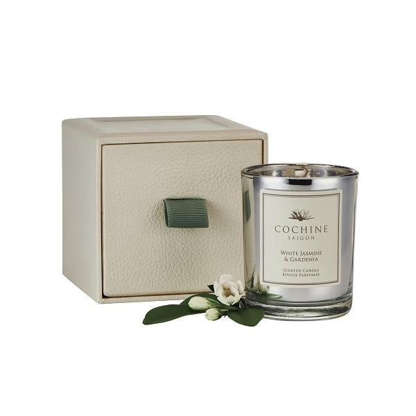White petals of Jasmine, Gardenia and Peony combine to unfold an enchanting aura that is soft yet elegant. Jasmine thrives in the heat of southern Vietnam where the petals are picked after nightfall when their fragrance is most intense. Beautifully presented in a signature Cochine shagreen box, at 65g, this luxury votive is the ideal size for both home and travel use, with all the elegance and chic of our traditional sizes.